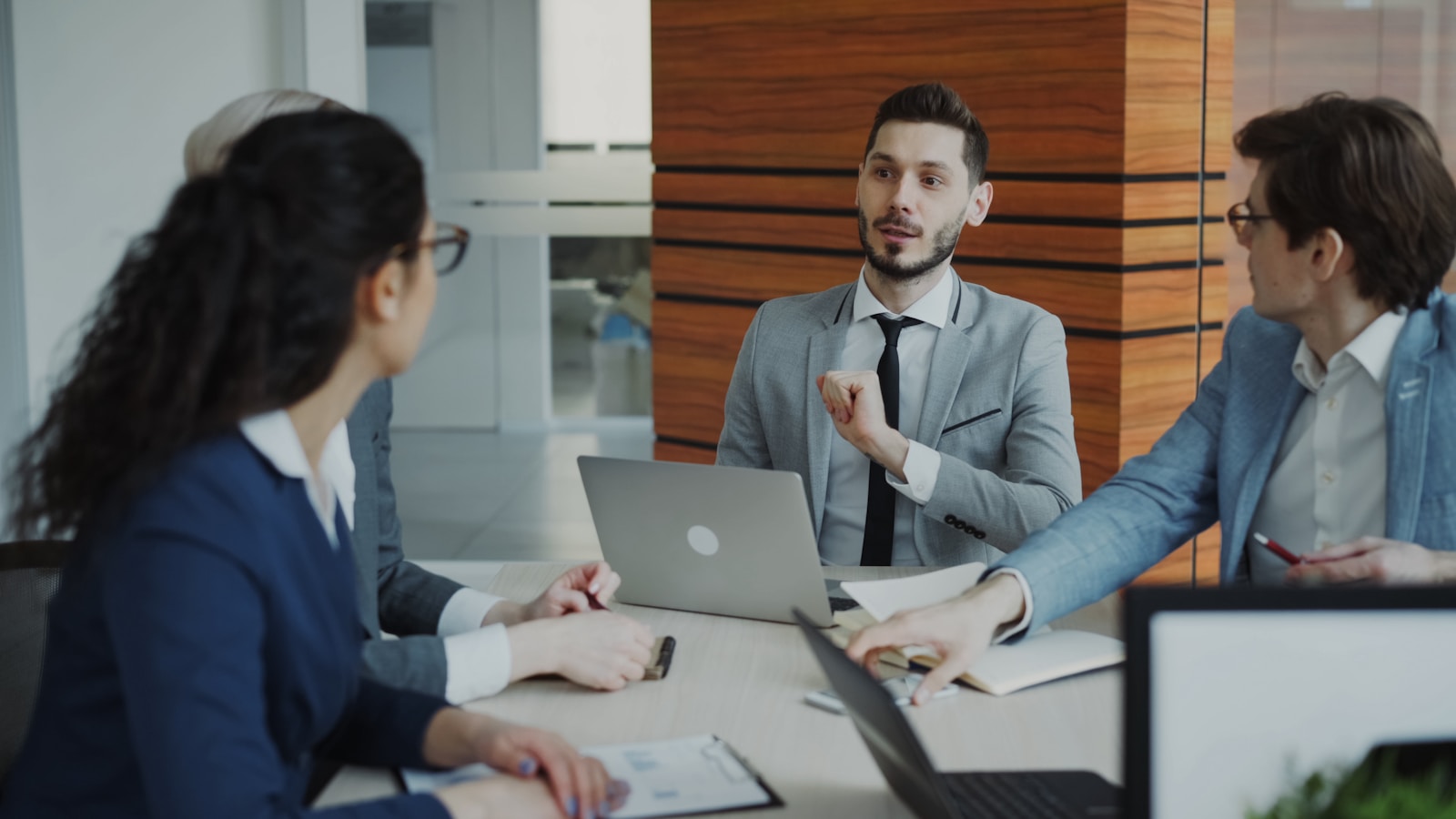 Business people collaborating in a modern office meeting.
